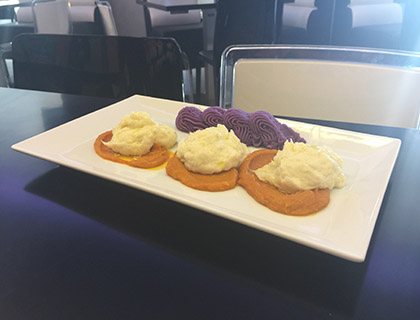 Baccalà mantecato con crema di zucca e purè di patate viola